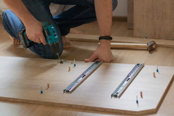 a-man-is-assembling-a-closet-for-a-children-s-room-2022-11-11-10-52-18-utc